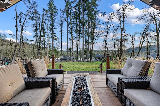deck featuring a yard and a mountain view