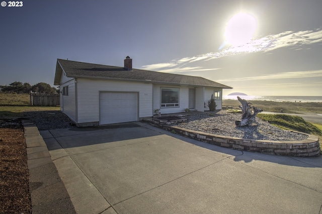 single story home featuring a garage