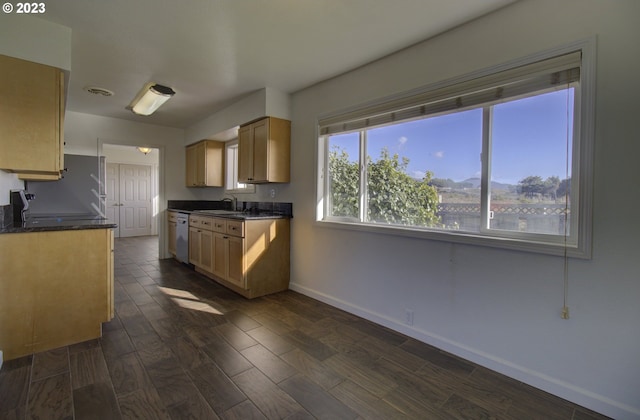 kitchen with light brown cabinetry, sink, refrigerator, dark hardwood / wood-style flooring, and dishwashing machine