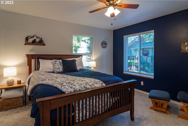 carpeted bedroom featuring ceiling fan