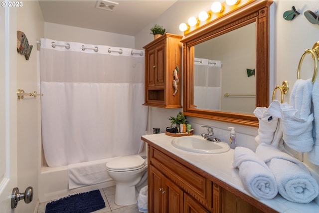 full bathroom with shower / tub combo, tile flooring, toilet, and vanity