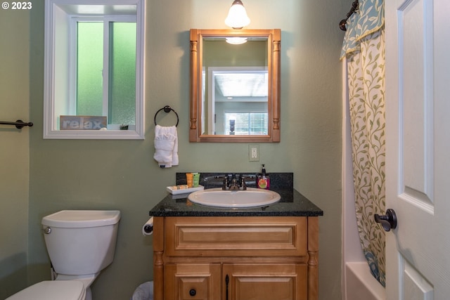 full bathroom with toilet, vanity, and shower / bathtub combination with curtain