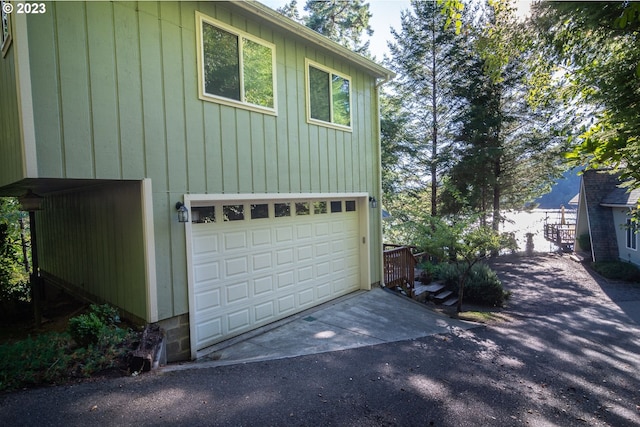 view of side of home featuring a garage