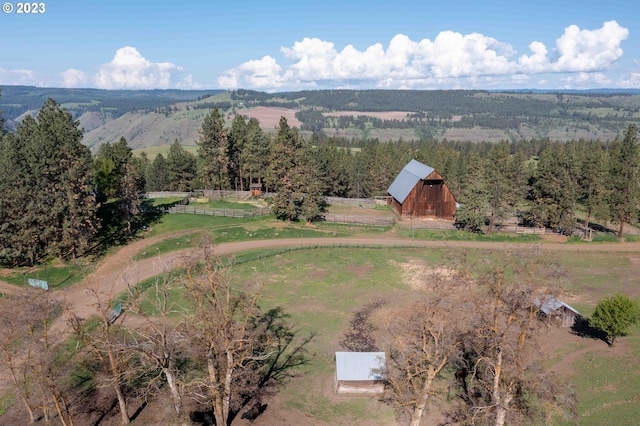 birds eye view of property with a rural view