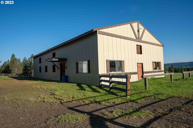 view of side of home with a lawn