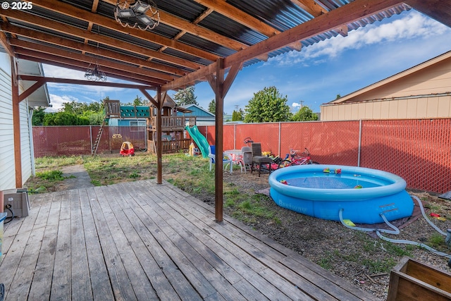 5360 B St, Springfield, OR 97478 - wooden deck featuring a playground and a fenced backyard