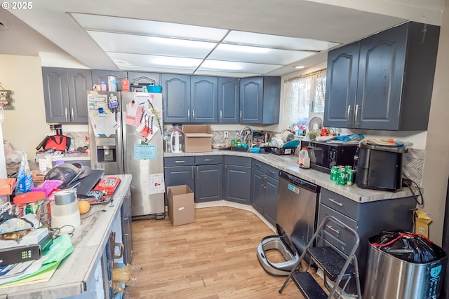 5360 B St, Springfield, OR 97478 - kitchen with light wood finished floors, light countertops, and appliances with stainless steel finishes