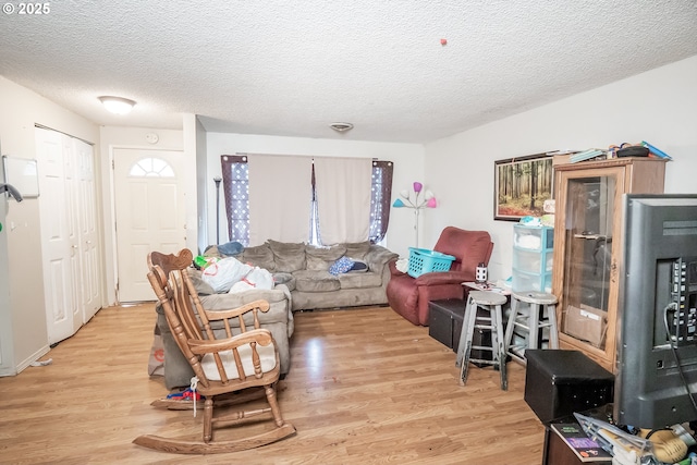 5360 B St, Springfield, OR 97478 - living area with light wood finished floors and a textured ceiling