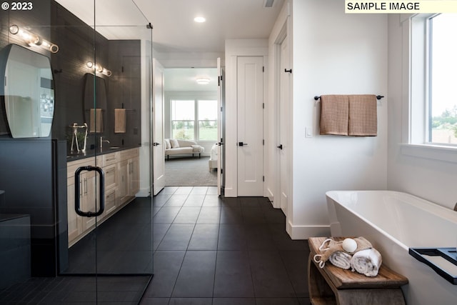 bathroom with independent shower and bath and tile patterned flooring