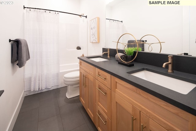 full bathroom with vanity, toilet, shower / bath combo with shower curtain, and tile patterned flooring