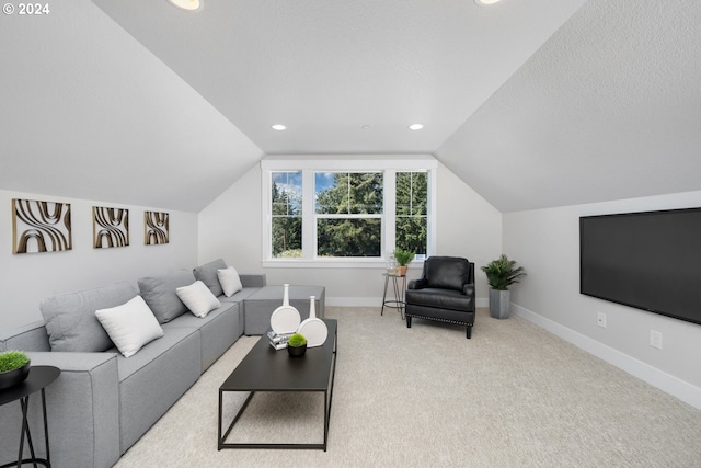 living room featuring light carpet and vaulted ceiling