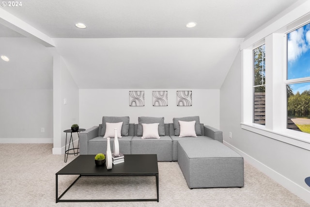 living room with carpet floors and lofted ceiling