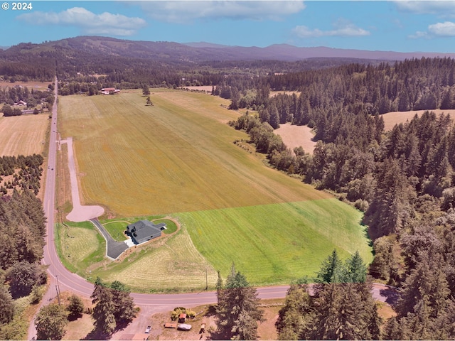 drone / aerial view with a mountain view and a rural view