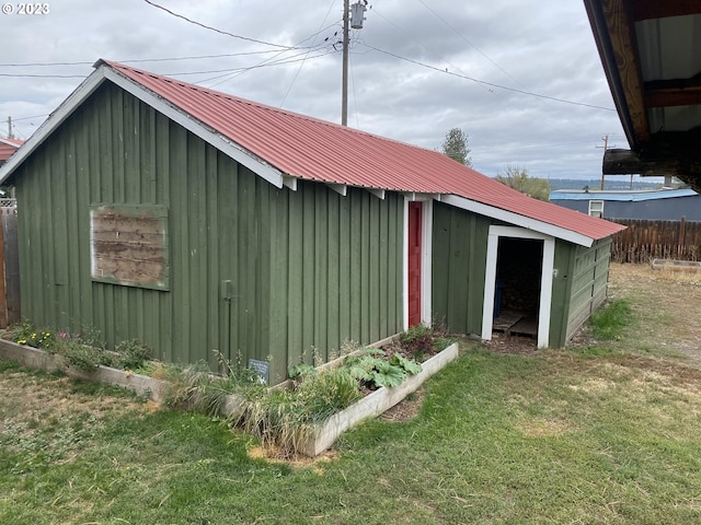 view of shed / structure with a yard