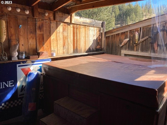 view of patio / terrace with a hot tub