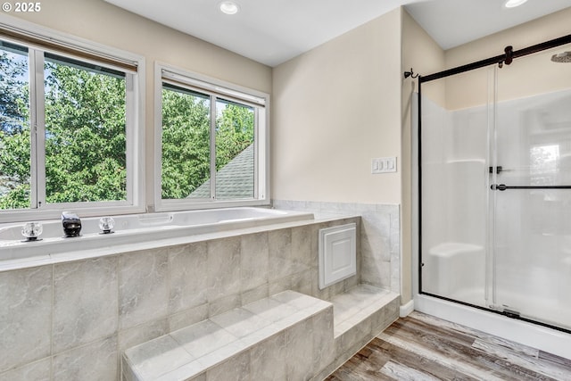 2940 Robinwood Dr, Forest Grove, OR 97116 - bathroom with a shower stall, a garden tub, recessed lighting, wood finished floors, and tile walls
