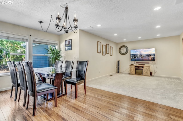 2940 Robinwood Dr, Forest Grove, OR 97116 - dining space featuring baseboards, a textured ceiling, a chandelier, light wood finished floors, and recessed lighting