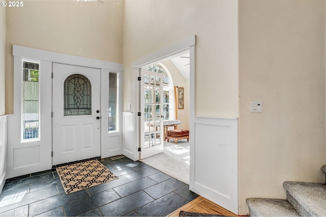 2940 Robinwood Dr, Forest Grove, OR 97116 - entrance foyer with stairway, a high ceiling, and stone tile flooring