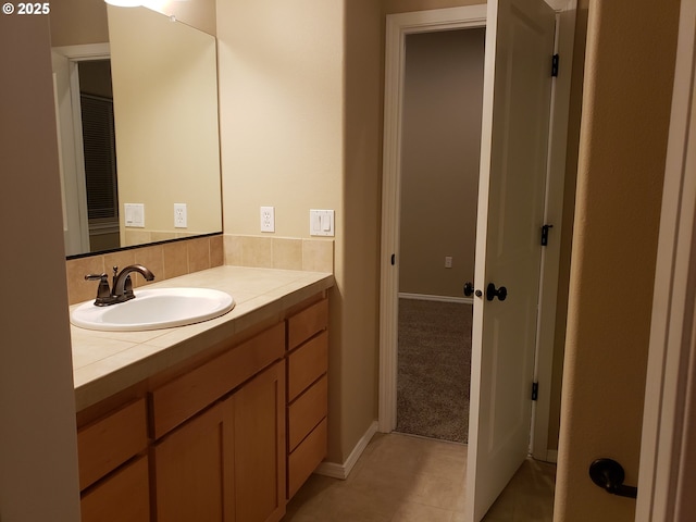 bathroom featuring vanity and tile patterned flooring