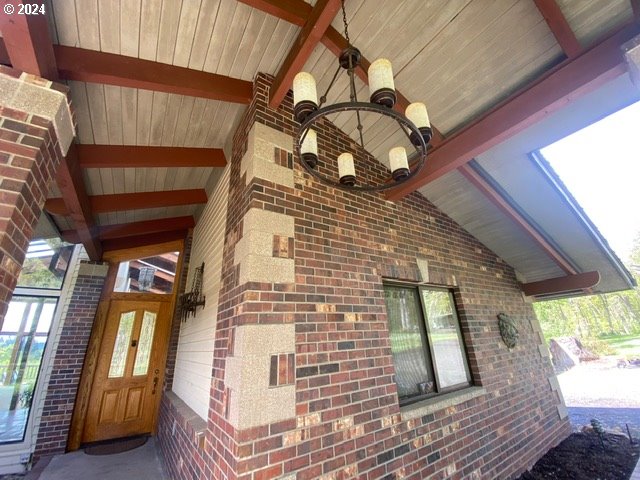 exterior space featuring brick siding