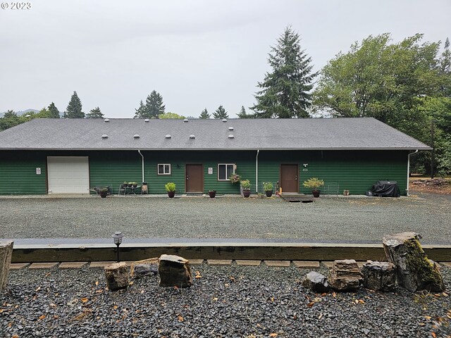 back of house with a garage