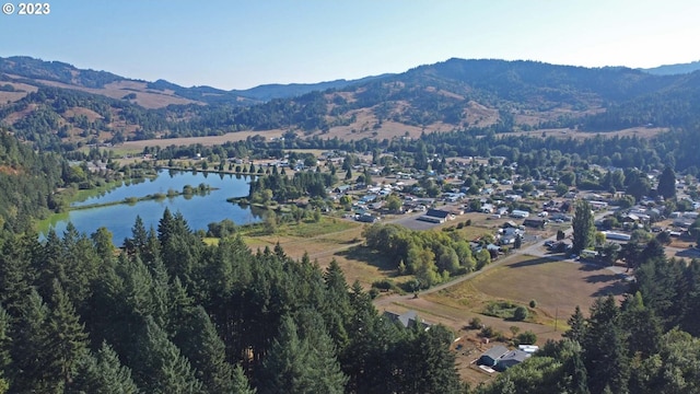 711 H Ave, Powers, OR 97466 - aerial overview of property's location with a water and mountain view