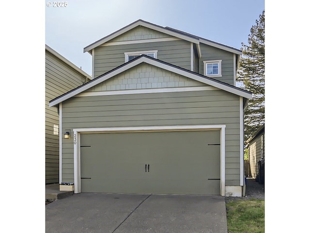 garage with concrete driveway