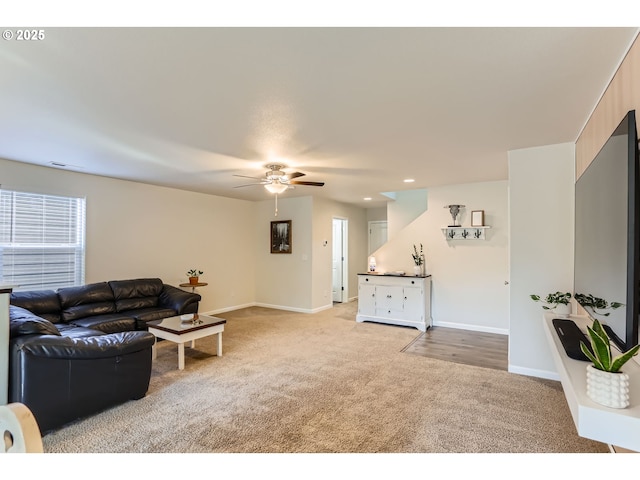 living room with baseboards, ceiling fan, recessed lighting, and light colored carpet