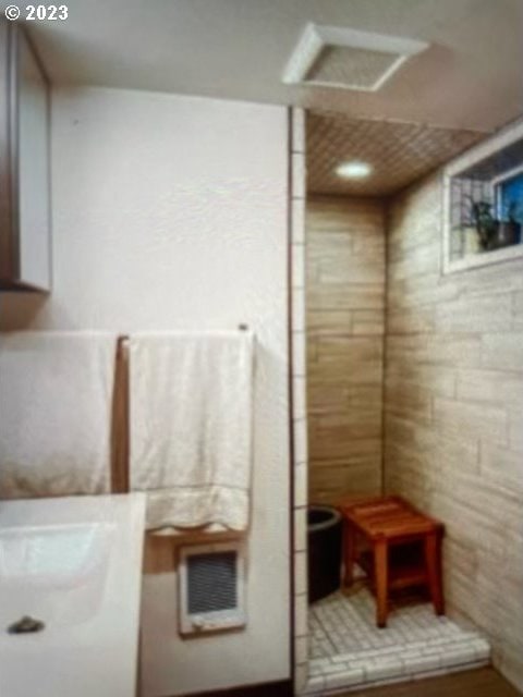 bathroom with tile walls