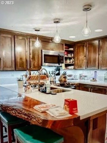 kitchen with a breakfast bar and hanging light fixtures