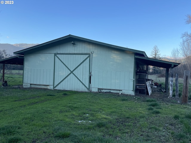 view of shed / structure with a lawn