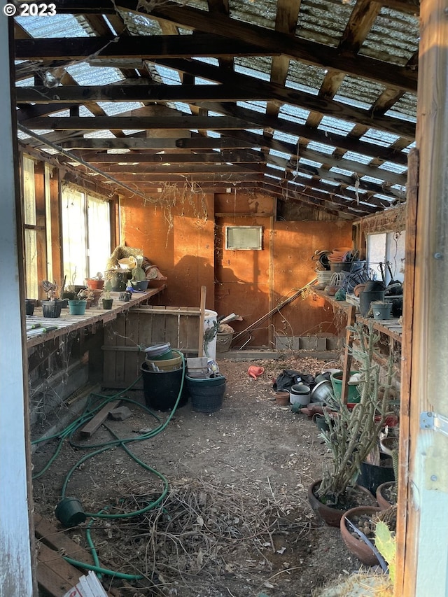 miscellaneous room featuring lofted ceiling