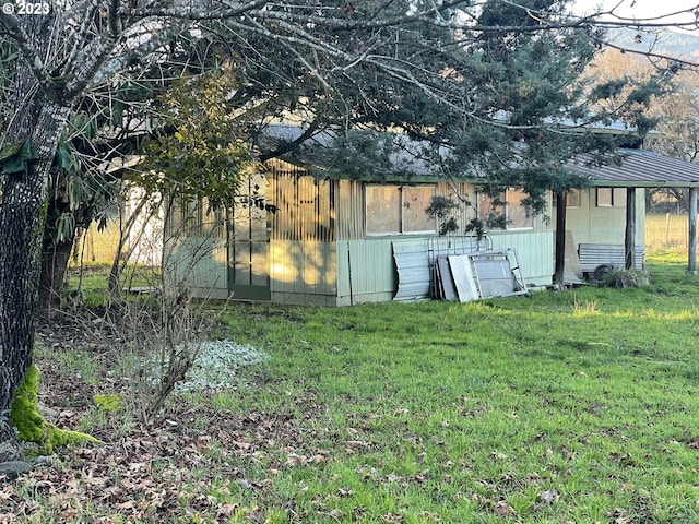 view of shed / structure featuring a yard