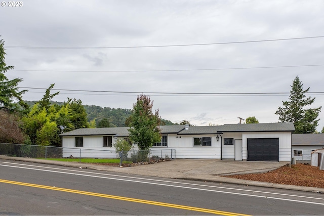 single story home with a garage