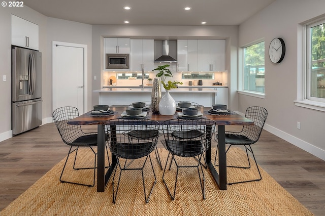 dining space featuring dark wood-type flooring