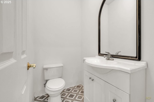 bathroom with toilet and vanity