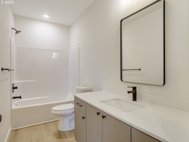 full bathroom featuring bathtub / shower combination, toilet, vanity, and hardwood / wood-style flooring