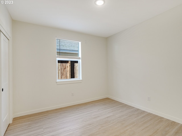 spare room featuring light hardwood / wood-style flooring