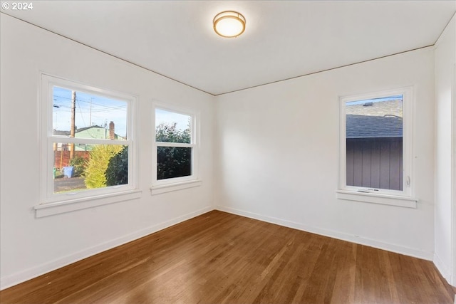 spare room featuring hardwood / wood-style floors