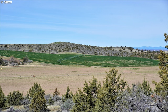 view of mountain feature with a rural view