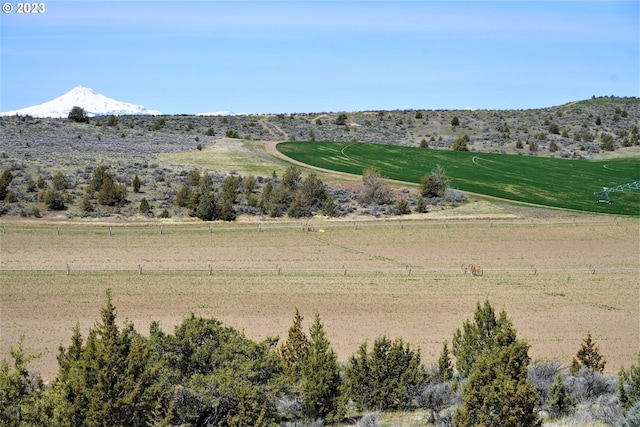 mountain view featuring a rural view