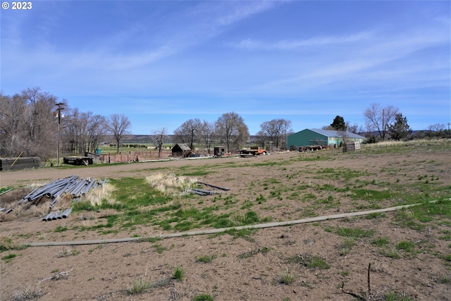 view of yard with a rural view