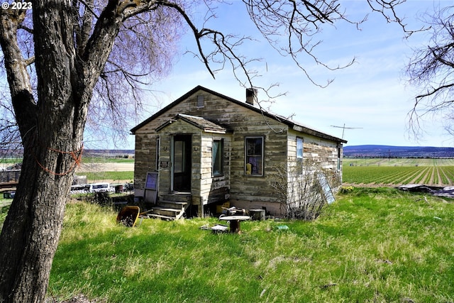 view of outdoor structure with a rural view