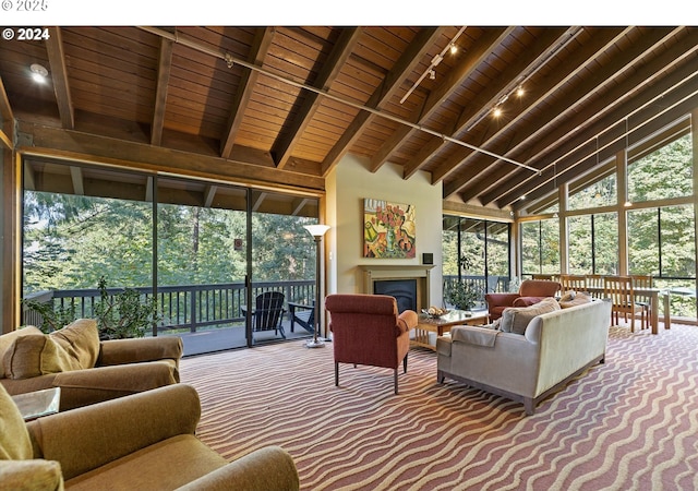 7730 SW Barnes Rd Unit B, Portland, OR 97225 - carpeted living area with rail lighting, wooden ceiling, beamed ceiling, high vaulted ceiling, and a fireplace