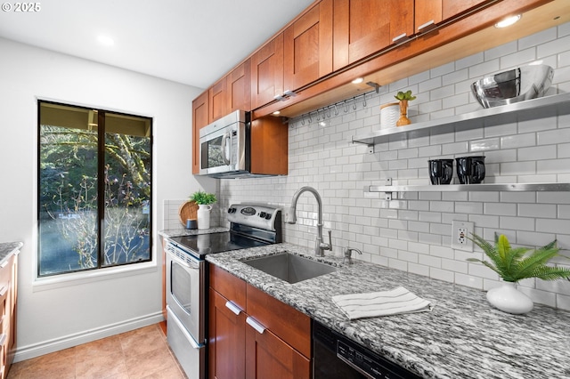 7730 SW Barnes Rd Unit B, Portland, OR 97225 - kitchen with appliances with stainless steel finishes, open shelves, a sink, backsplash, and light stone counters