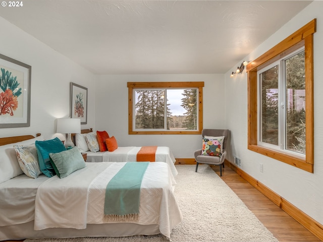 bedroom with light hardwood / wood-style floors