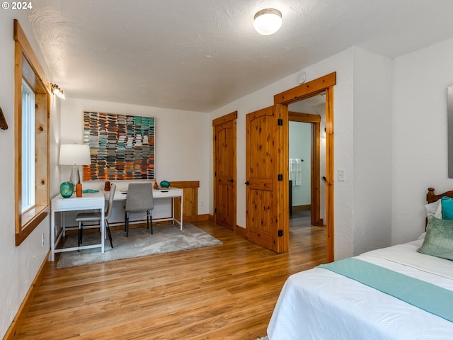 bedroom with light wood-type flooring