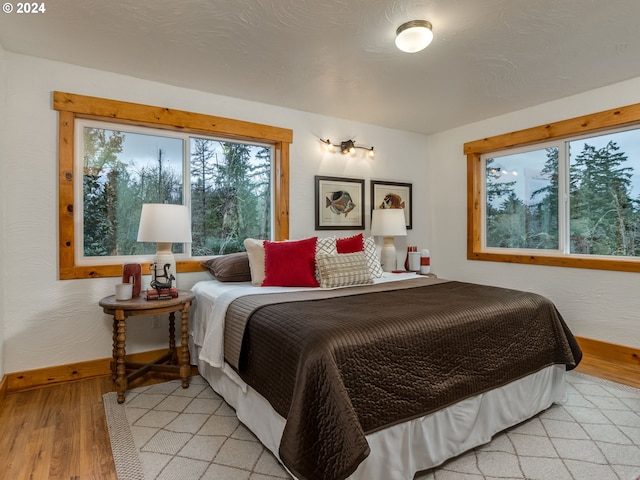 bedroom with light wood-type flooring