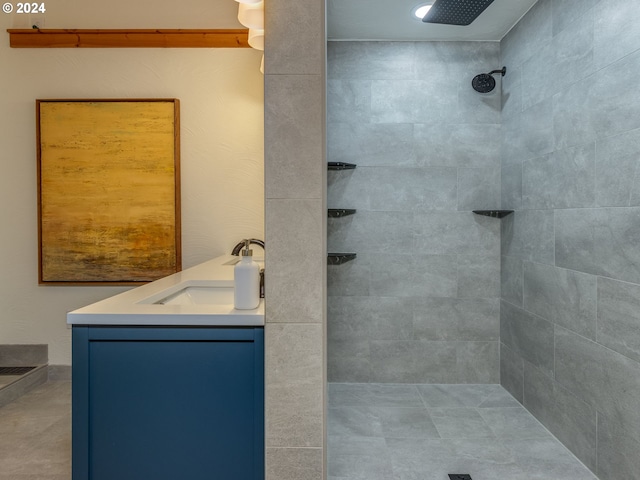 bathroom featuring vanity and a tile shower