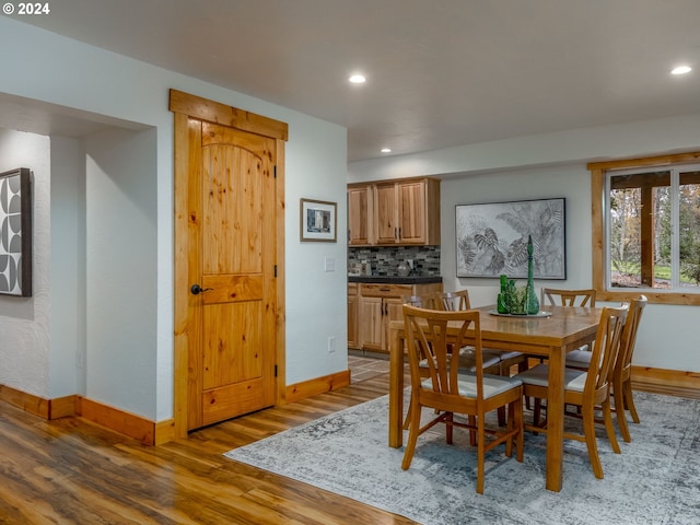 dining area with wood-type flooring